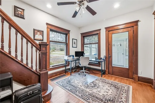 a living room with furniture rug and window