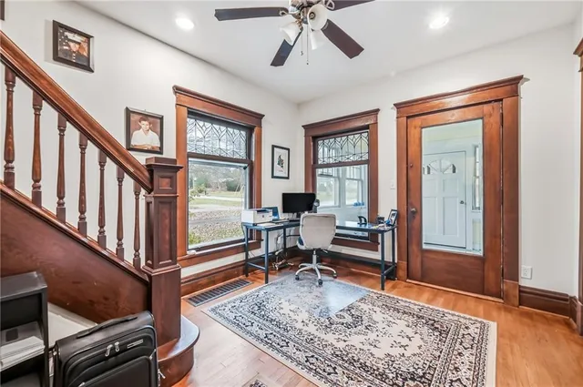 a living room with furniture rug and window
