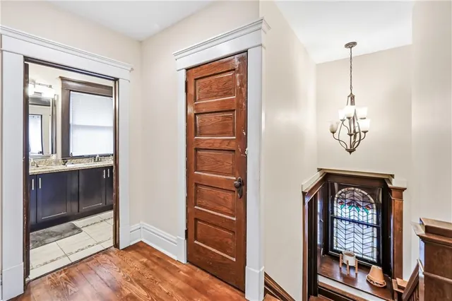 a view of an entryway with wooden floor
