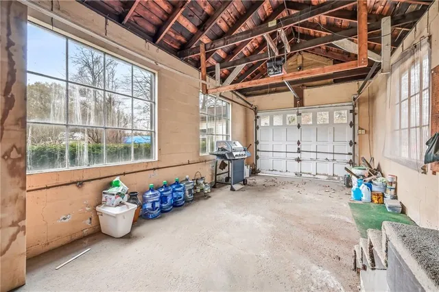 a storage room with lots of furniture and a window