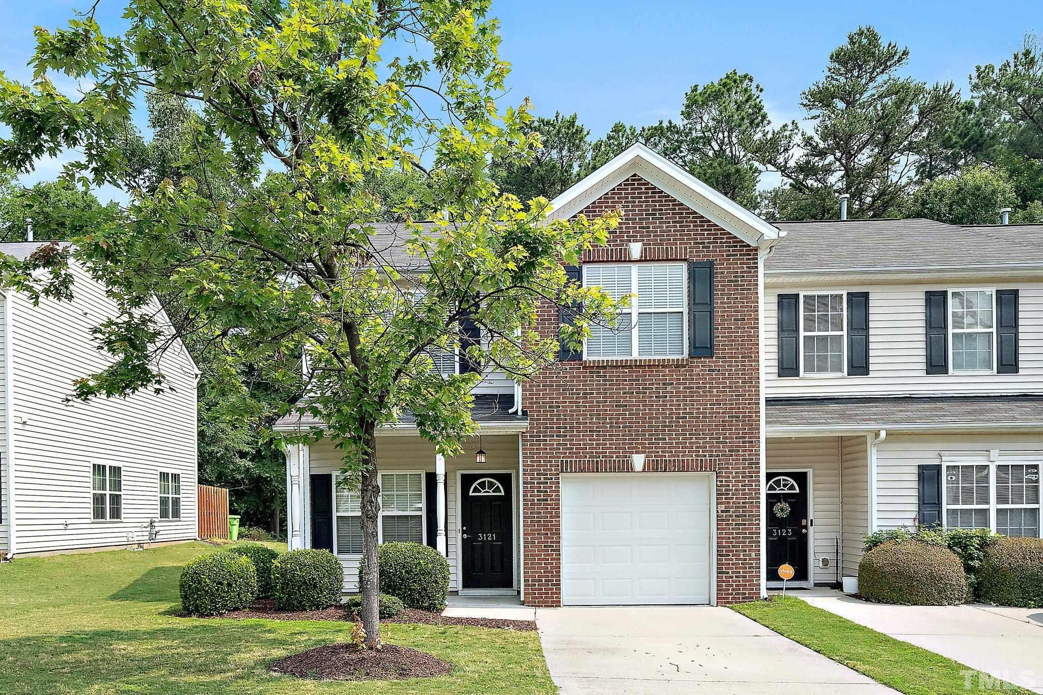 3121 Manhasset Lane Raleigh, NC 27604 - Photo 1 of 25 a front view of a house with a yard