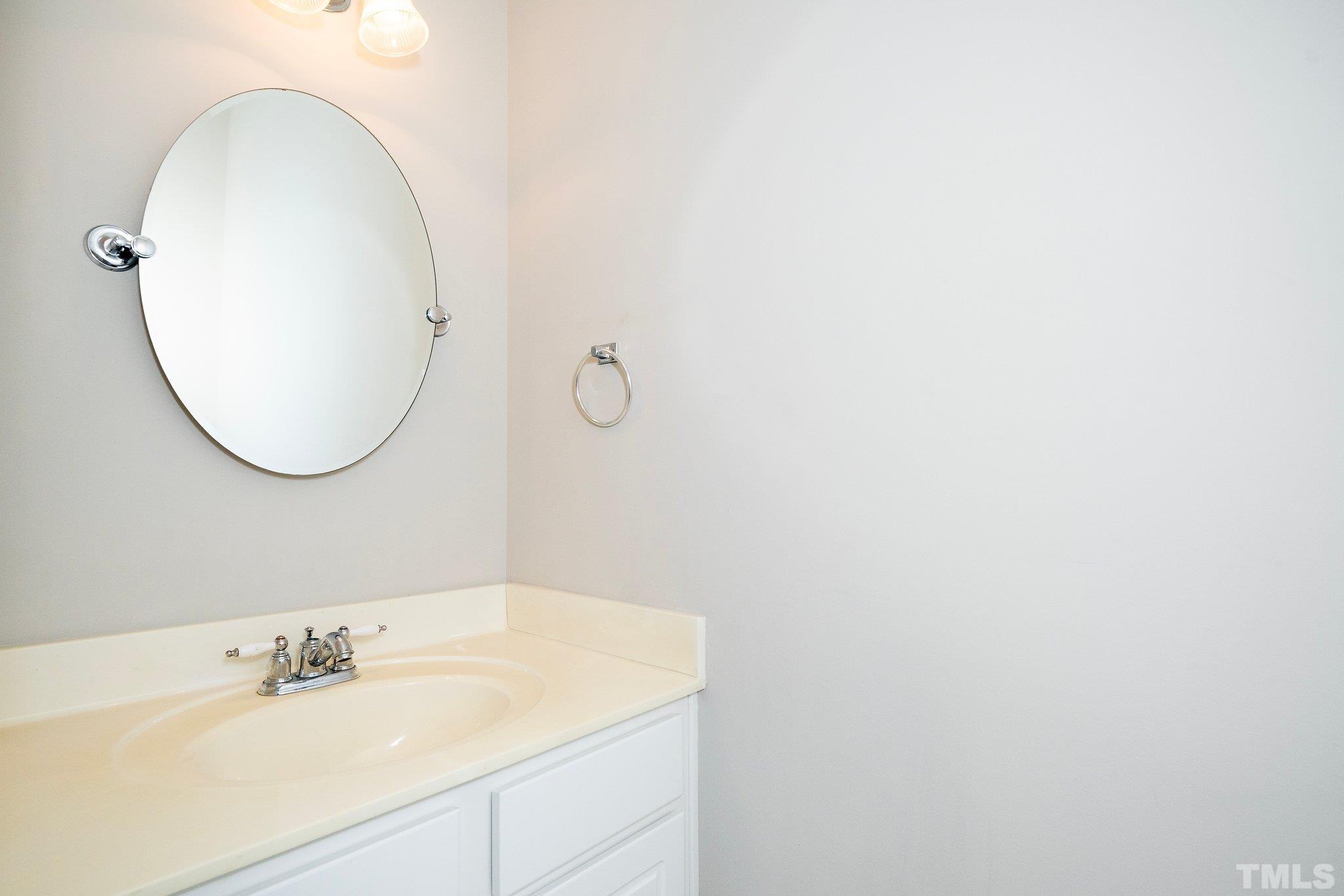 3121 Manhasset Lane Raleigh, NC 27604 - Photo 15 of 25 a bathroom with a sink and a mirror