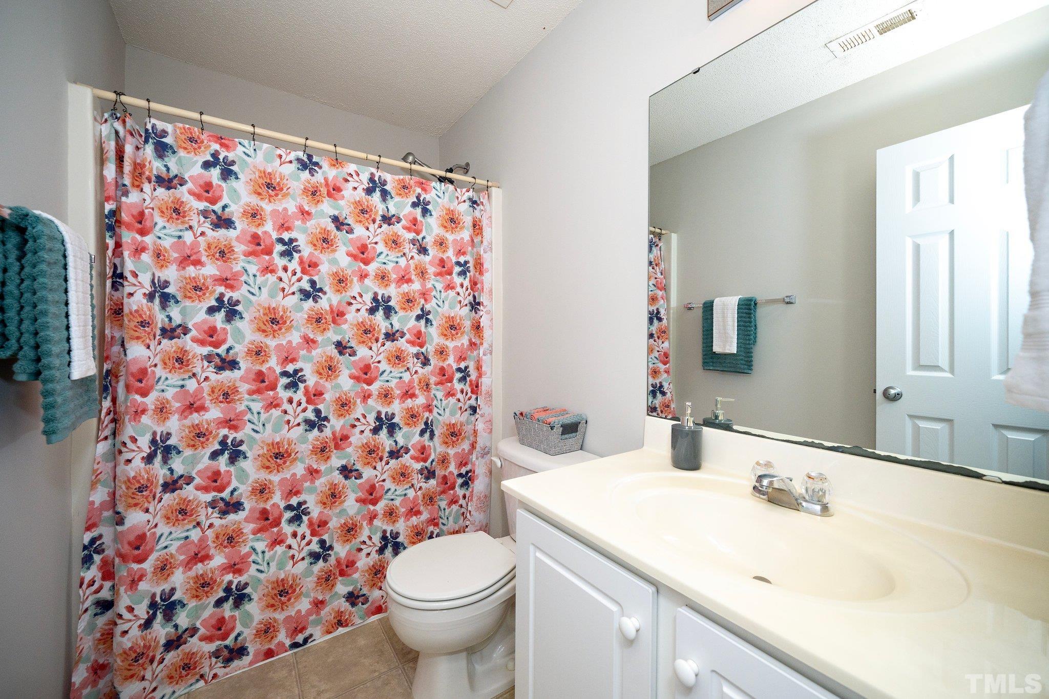 3121 Manhasset Lane Raleigh, NC 27604 - Photo 16 of 25 a bathroom with a sink toilet and shower