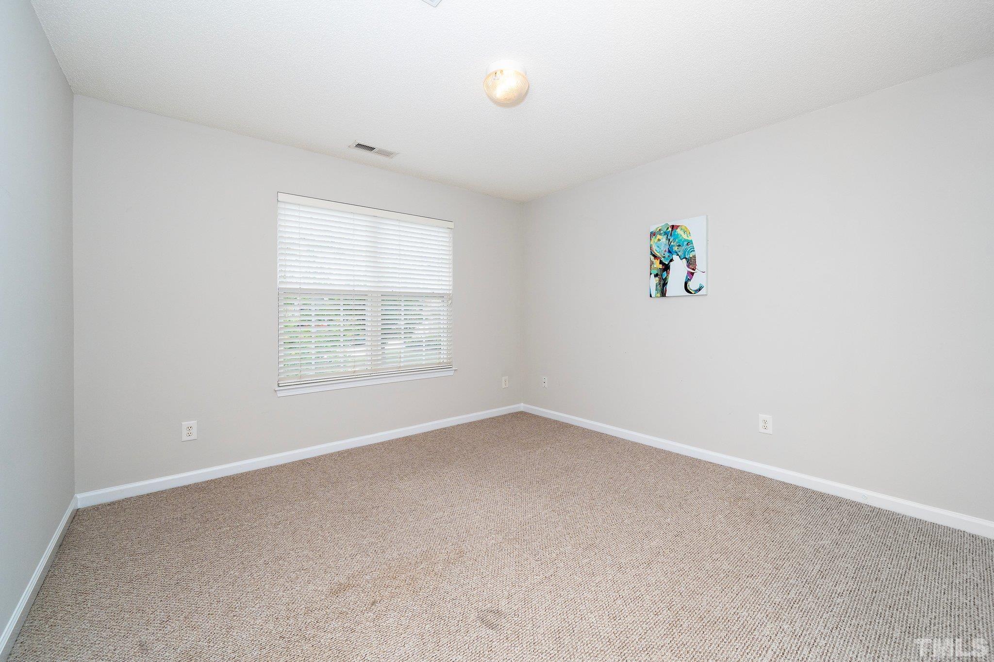 3121 Manhasset Lane Raleigh, NC 27604 - Photo 17 of 25 an empty room with a window