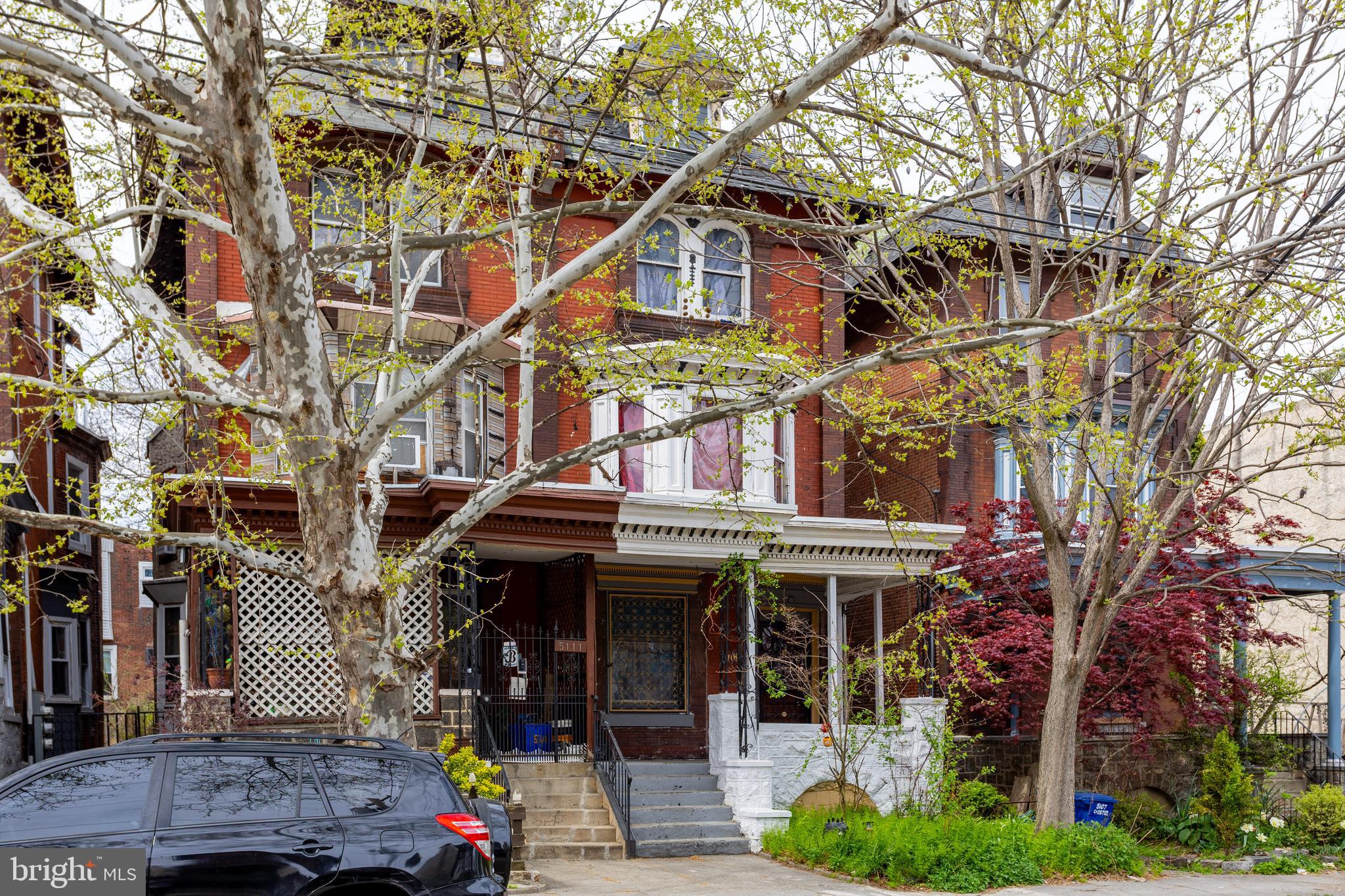 5109 Chester Avenue Philadelphia, PA 19143 - Photo 2 of 34 a view of a building with a tree