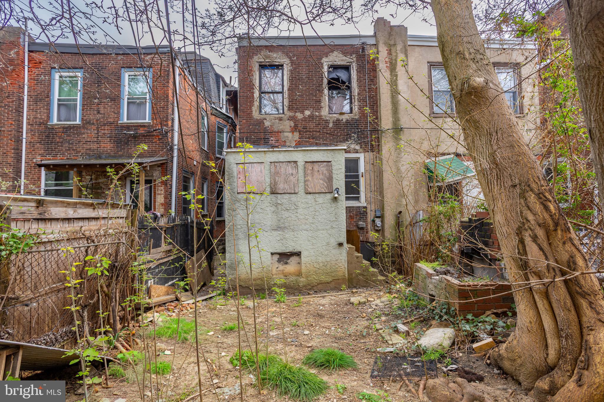 5109 Chester Avenue Philadelphia, PA 19143 - Photo 5 of 34 a view of a brick house with many windows