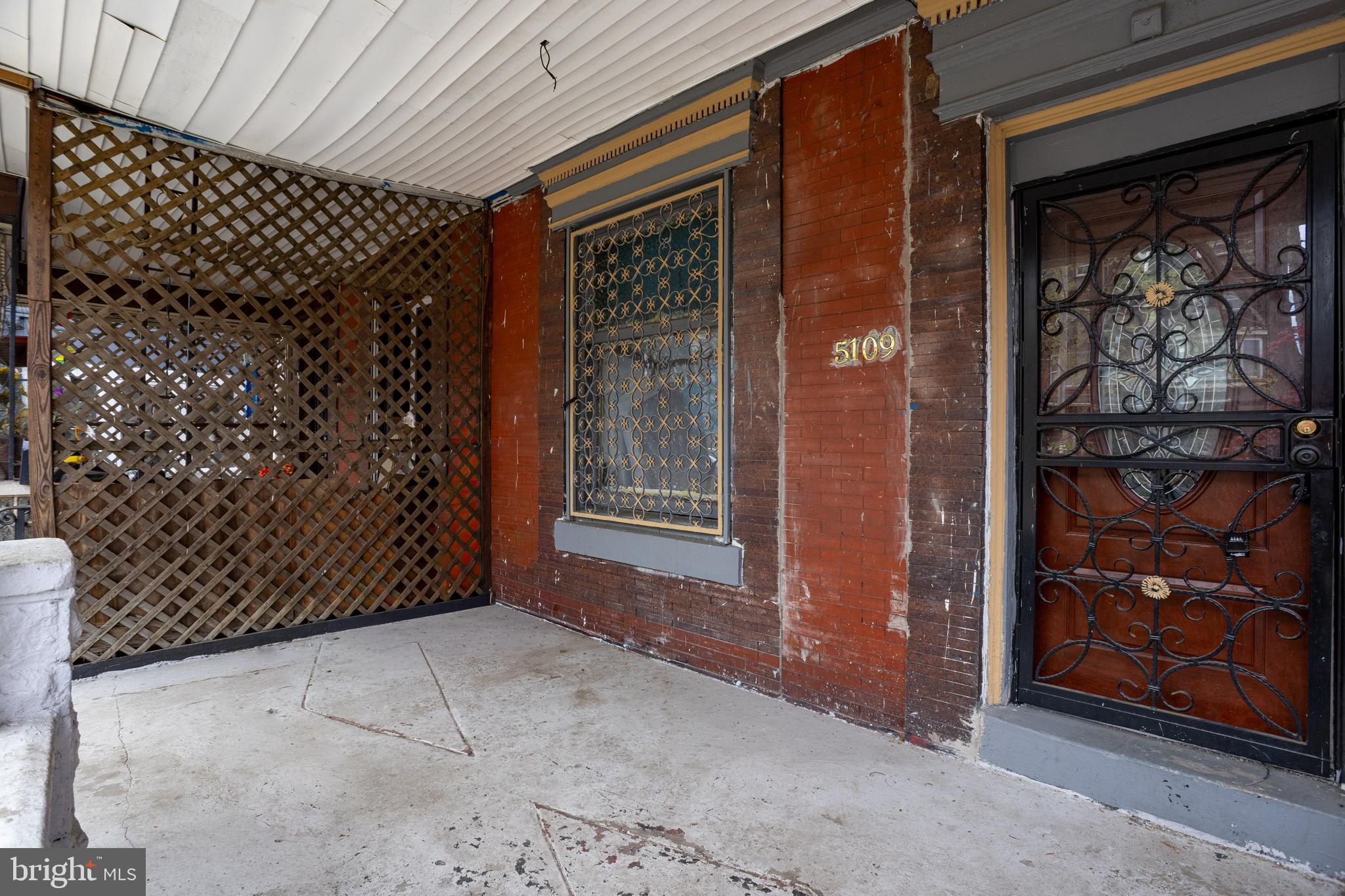 5109 Chester Avenue Philadelphia, PA 19143 - Photo 8 of 34 a view of a wooden door of the house