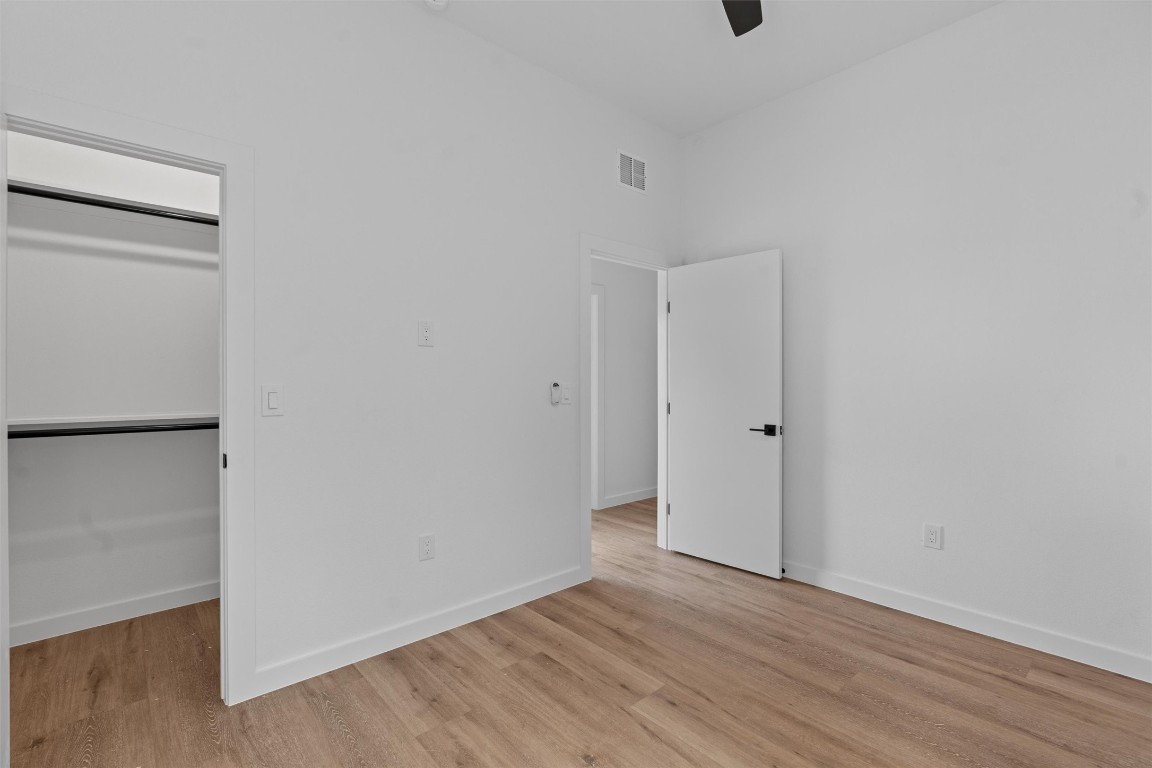 5601 Manor Road, Unit A Austin, TX 78723 - Photo 22 of 35 a view of an empty room with wooden floor