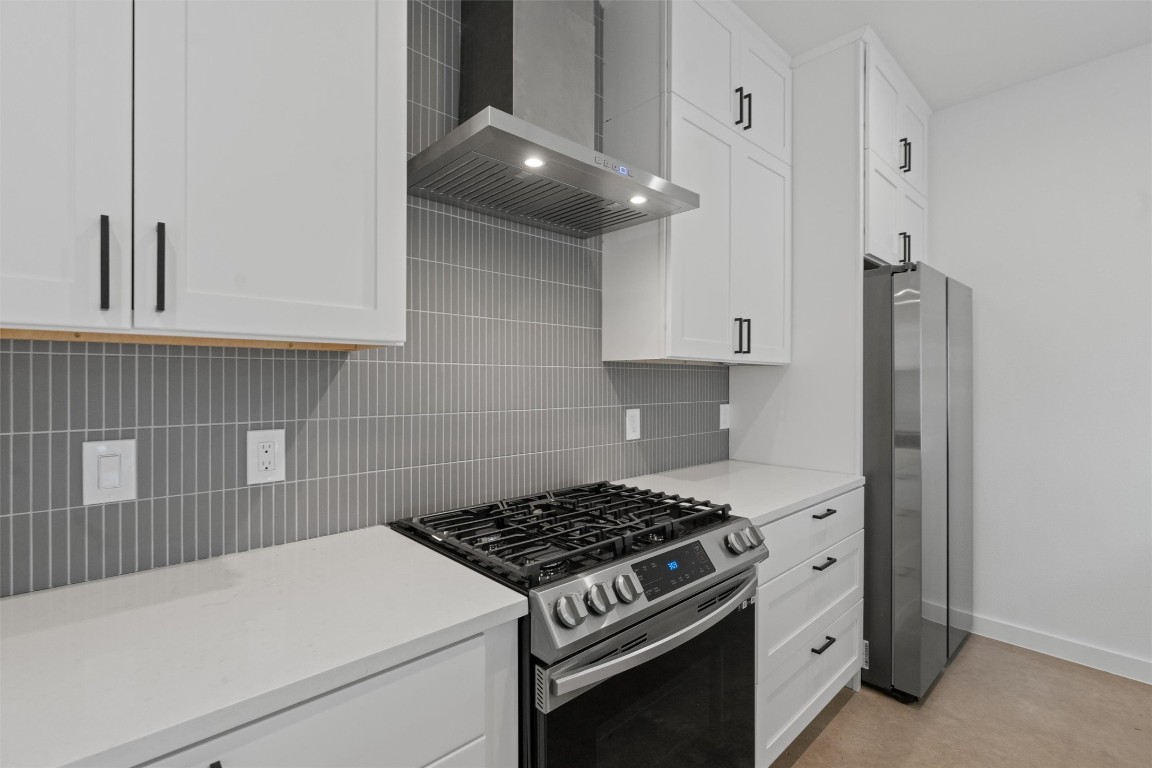 5601 Manor Road, Unit A Austin, TX 78723 - Photo 7 of 35 a kitchen with a stove and a refrigerator