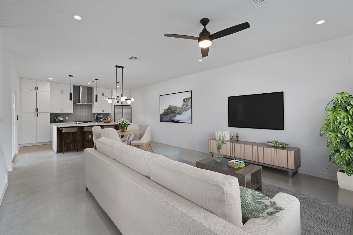 5601 Manor Road, Unit A Austin, TX 78723 - Photo 8 of 35 a living room with furniture and a flat screen tv