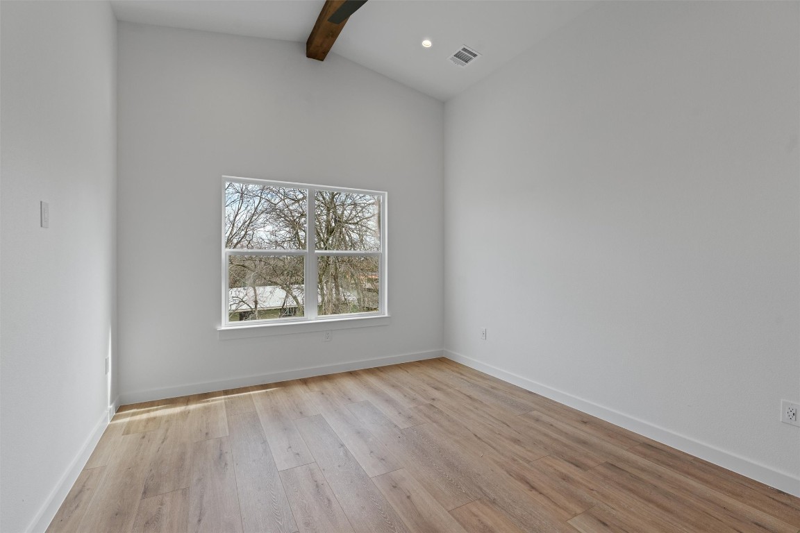 5601 Manor Road, Unit A Austin, TX 78723 - Photo 10 of 35 an empty room with wooden floor and windows