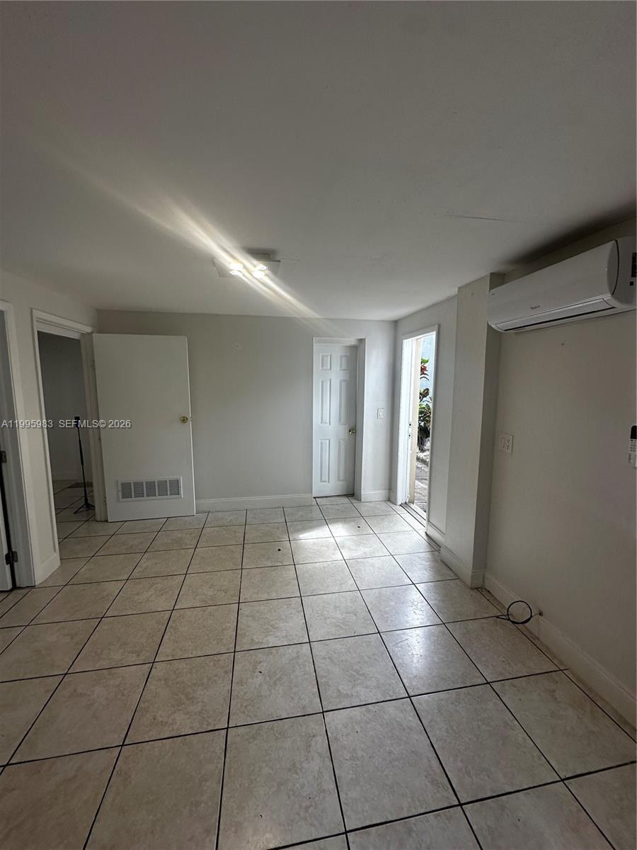 2420 Southwest 34th Avenue, Unit A Miami, FL 33145 - Photo 15 of 15 a view of an empty room and window
