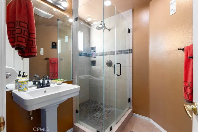a bathroom with a sink vanity and a mirror