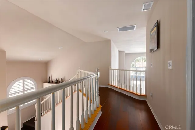 a view of entryway with wooden floor