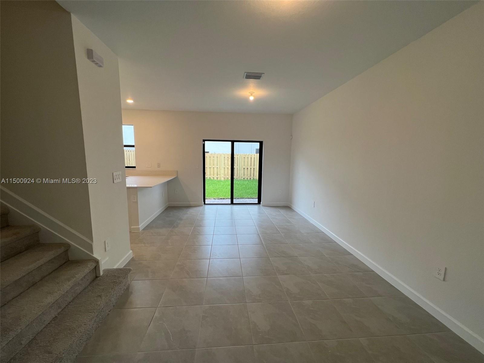 11743 Southwest 246th Terrace, Unit 11743 Homestead, FL 33032 - Photo 7 of 10 a view of a room and window