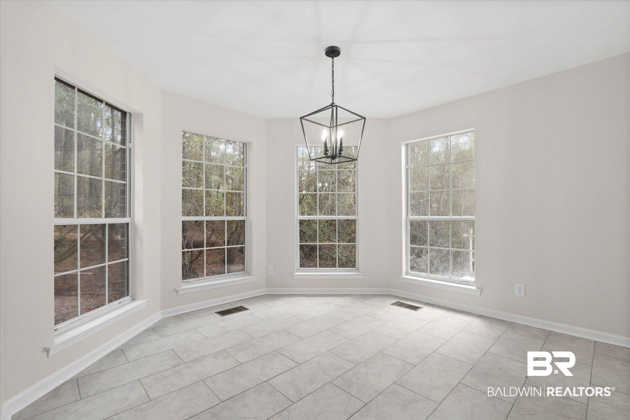 106 Melanie Loop Daphne, AL 36526 - Photo 11 of 45 Unfurnished dining area featuring suspended lighting and baseboards