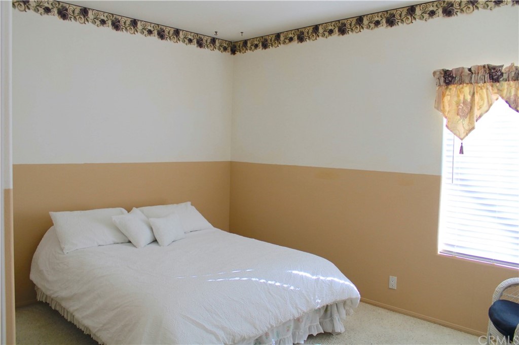 1299 Cll Sonia Fallbrook, CA 92028 - Photo 12 of 29 a bed sitting in a bedroom next to a window