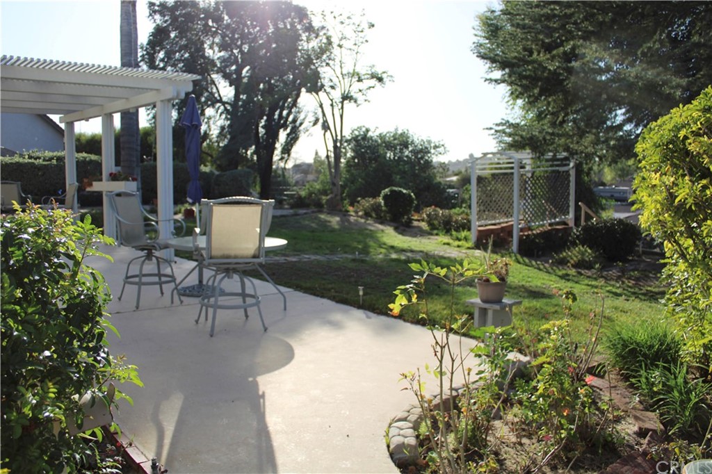 1299 Cll Sonia Fallbrook, CA 92028 - Photo 26 of 29 a view of a chair and table in backyard of the house