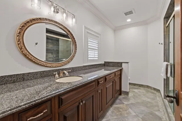 a bathroom with a sink a vanity and a mirror