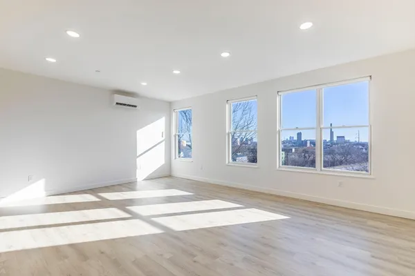 a view of an empty room with a window