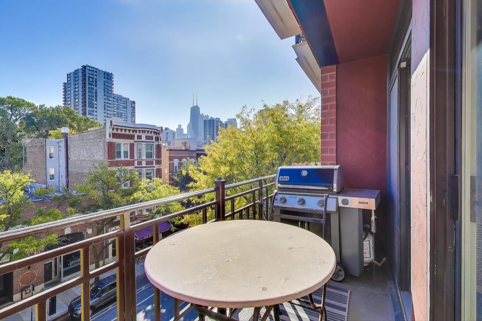 1414 North Wells Street, Unit 405 Chicago, IL 60610 - Photo 11 of 27 a view of a chairs and table in the balcony