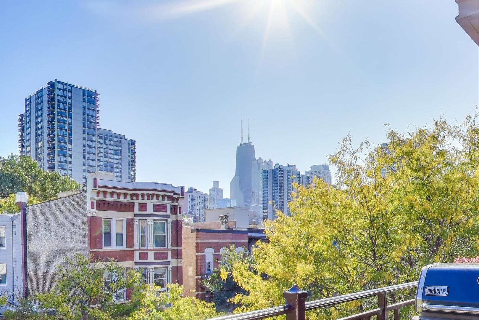 1414 North Wells Street, Unit 405 Chicago, IL 60610 - Photo 12 of 27 a view of a city with tall buildings