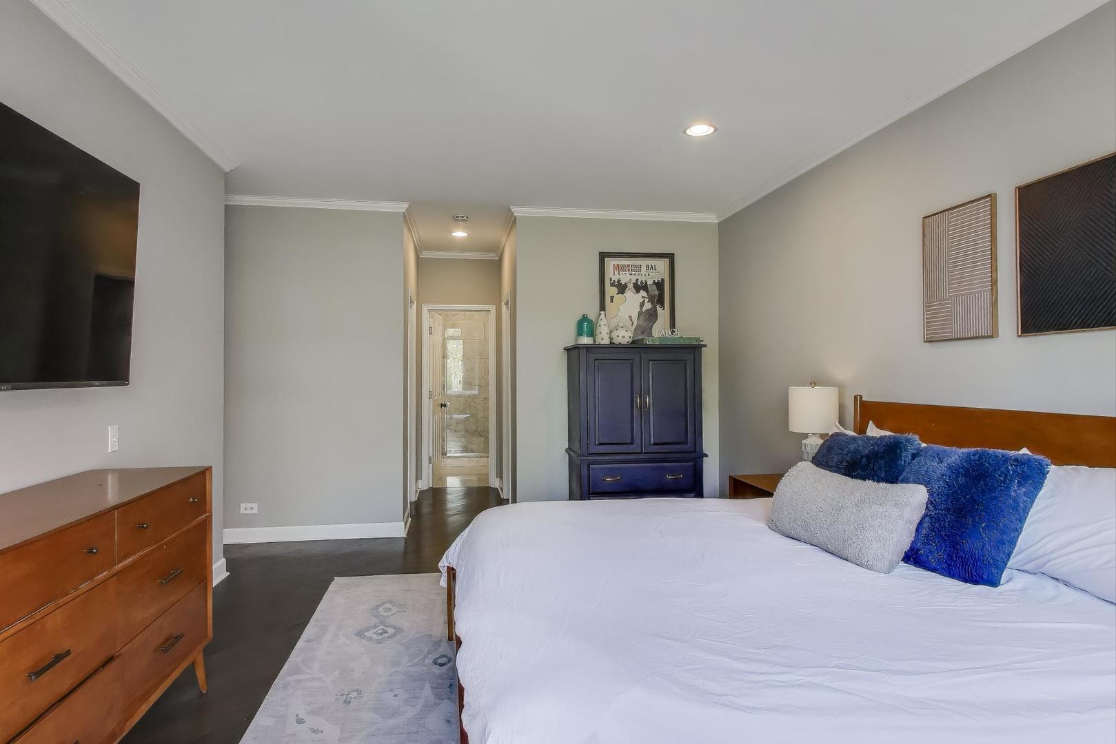 1414 North Wells Street, Unit 405 Chicago, IL 60610 - Photo 16 of 27 a bedroom with a bed and flat screen tv