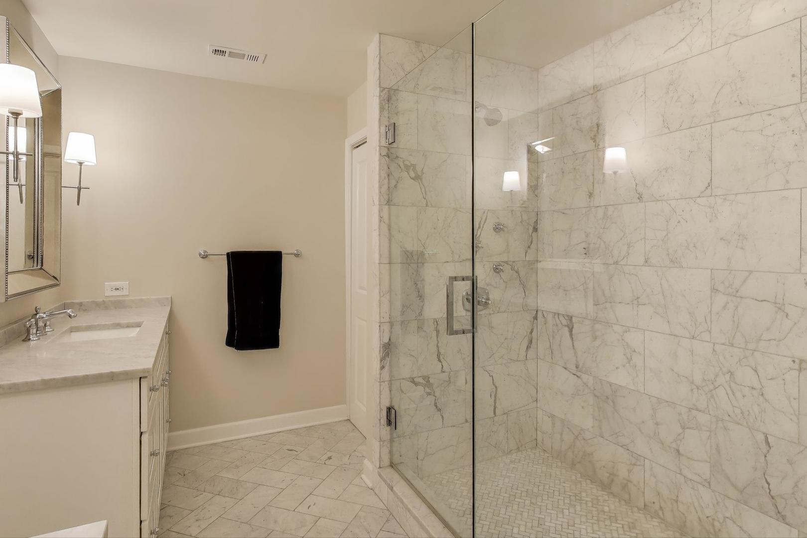 1414 North Wells Street, Unit 405 Chicago, IL 60610 - Photo 17 of 27 a bathroom with a shower and a sink