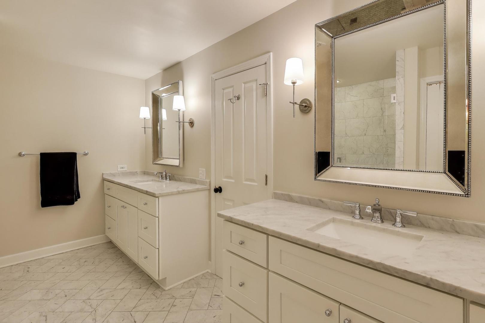 1414 North Wells Street, Unit 405 Chicago, IL 60610 - Photo 18 of 27 a bathroom with a granite countertop sink double and mirror