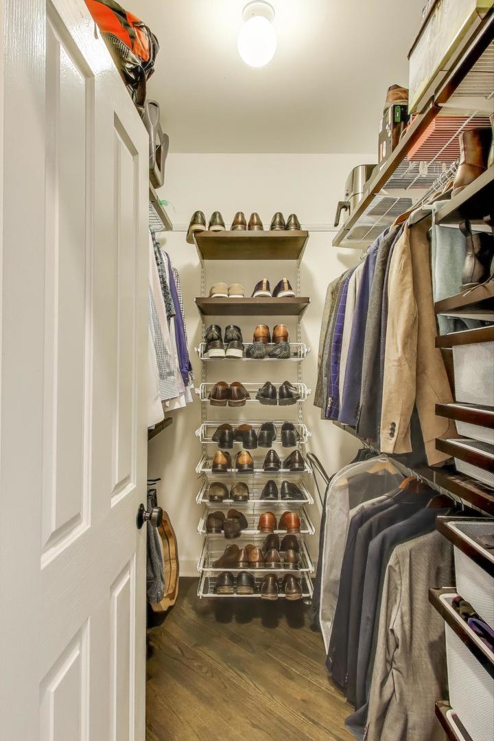 1414 North Wells Street, Unit 405 Chicago, IL 60610 - Photo 19 of 27 a view of walk in closet with clothes and shoes