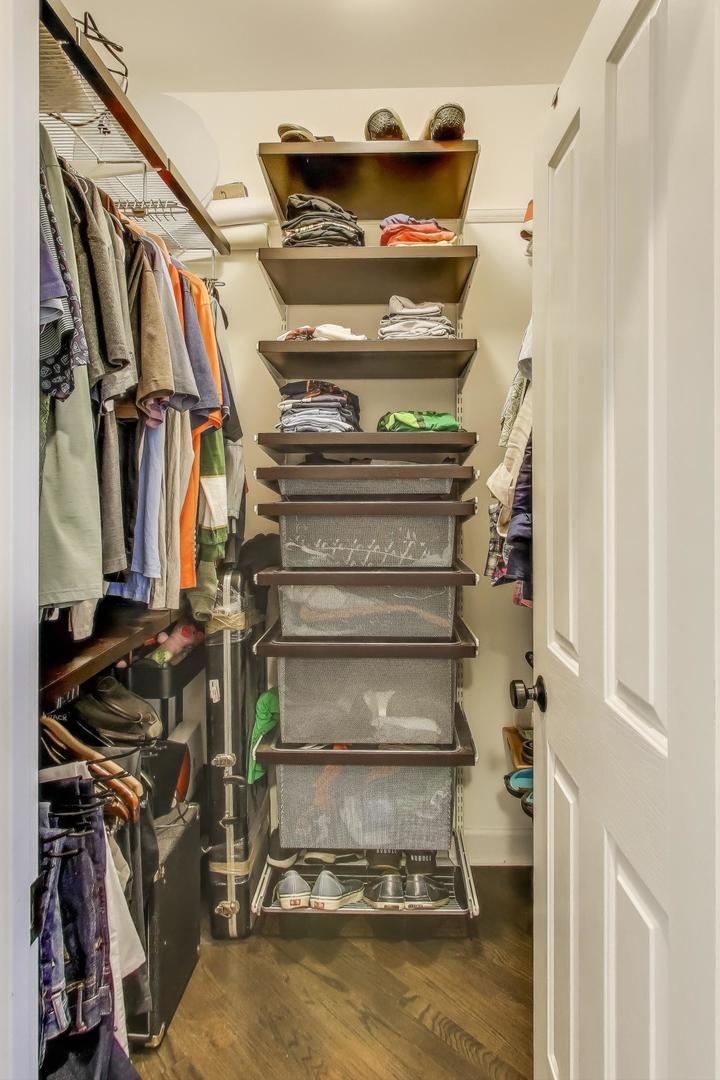 1414 North Wells Street, Unit 405 Chicago, IL 60610 - Photo 20 of 27 a view of walk in closet with clothes and shoes