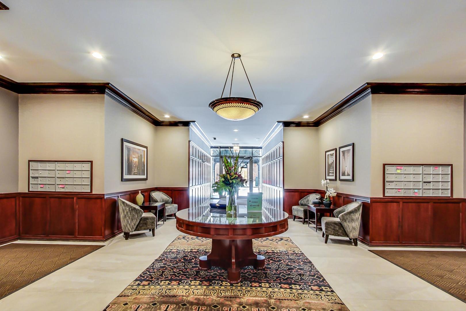 1414 North Wells Street, Unit 405 Chicago, IL 60610 - Photo 2 of 27 a living room with fireplace furniture and a window