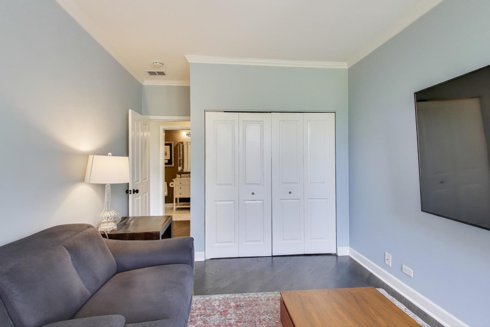 1414 North Wells Street, Unit 405 Chicago, IL 60610 - Photo 24 of 27 a living room with furniture and a lamp