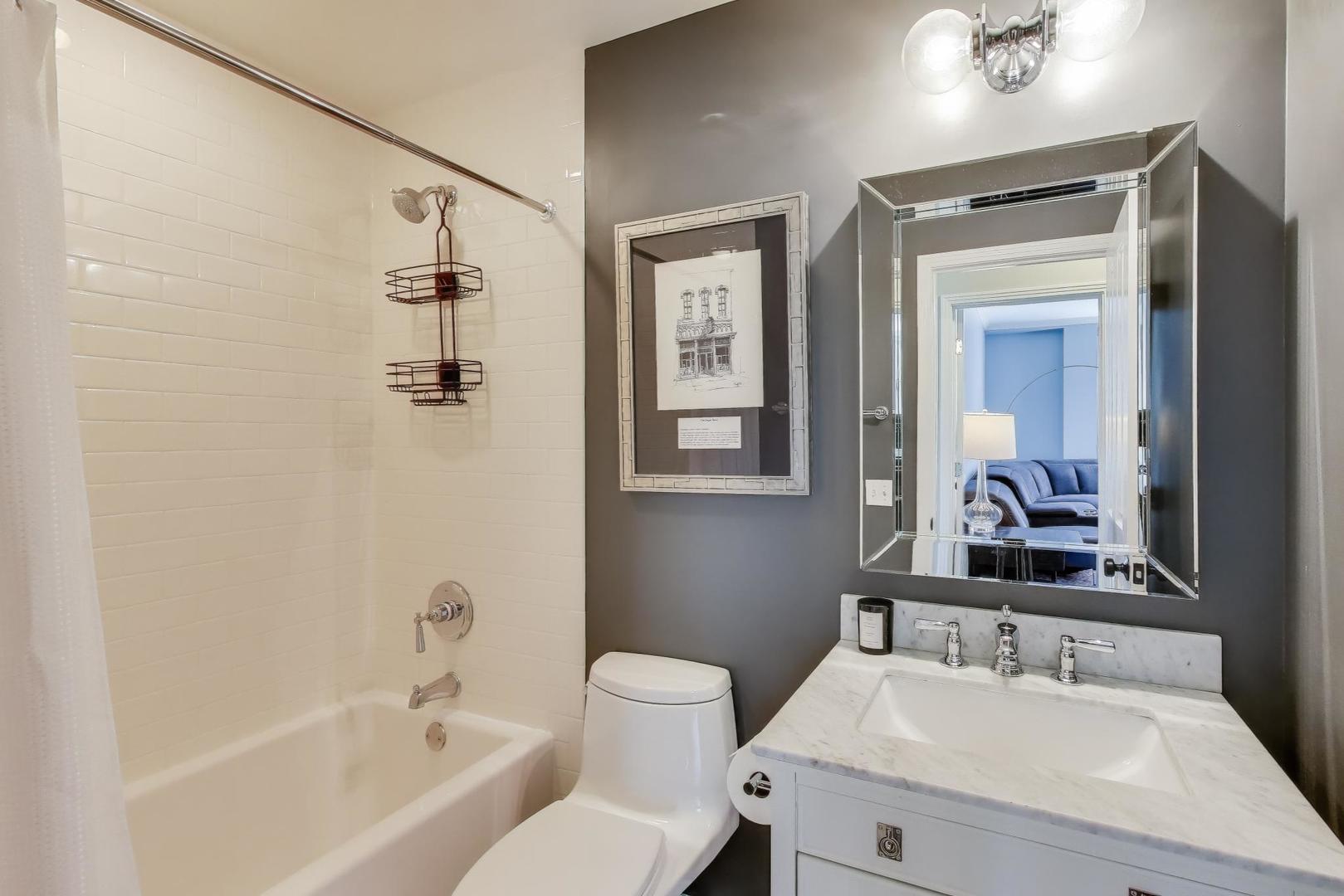 1414 North Wells Street, Unit 405 Chicago, IL 60610 - Photo 25 of 27 a bathroom with a sink toilet and shower