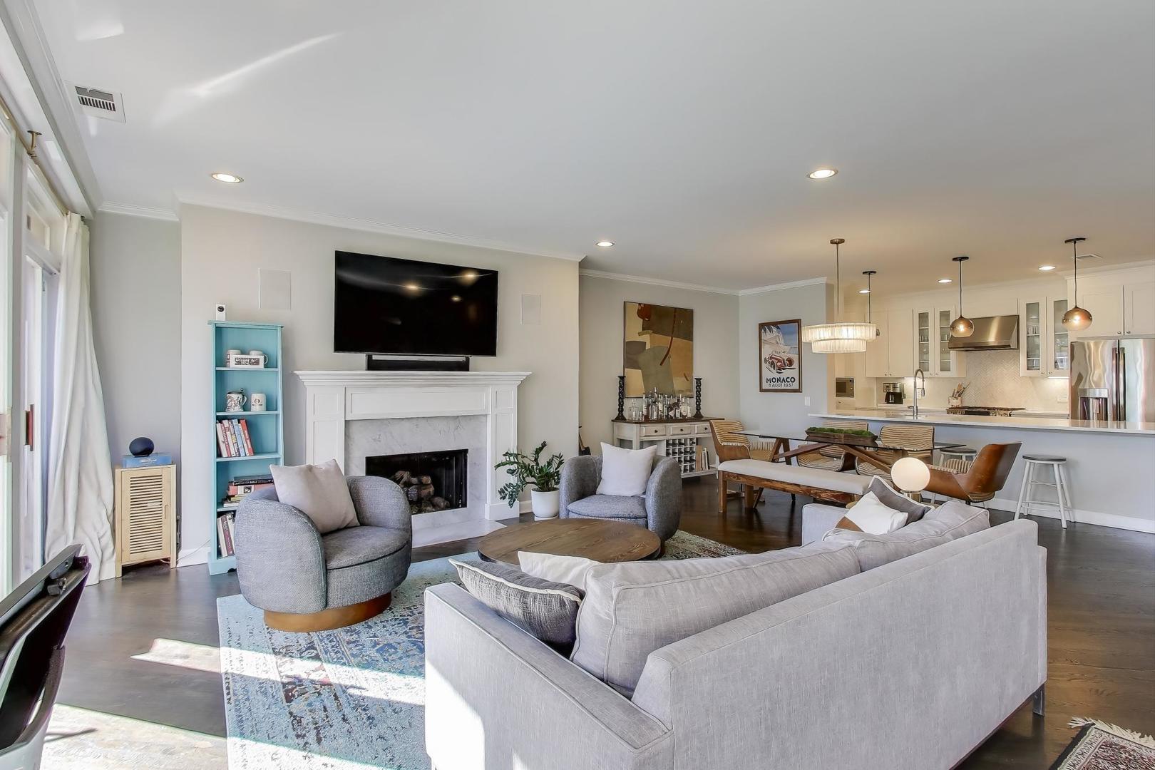 1414 North Wells Street, Unit 405 Chicago, IL 60610 - Photo 4 of 27 a living room with furniture a fireplace and a flat screen tv