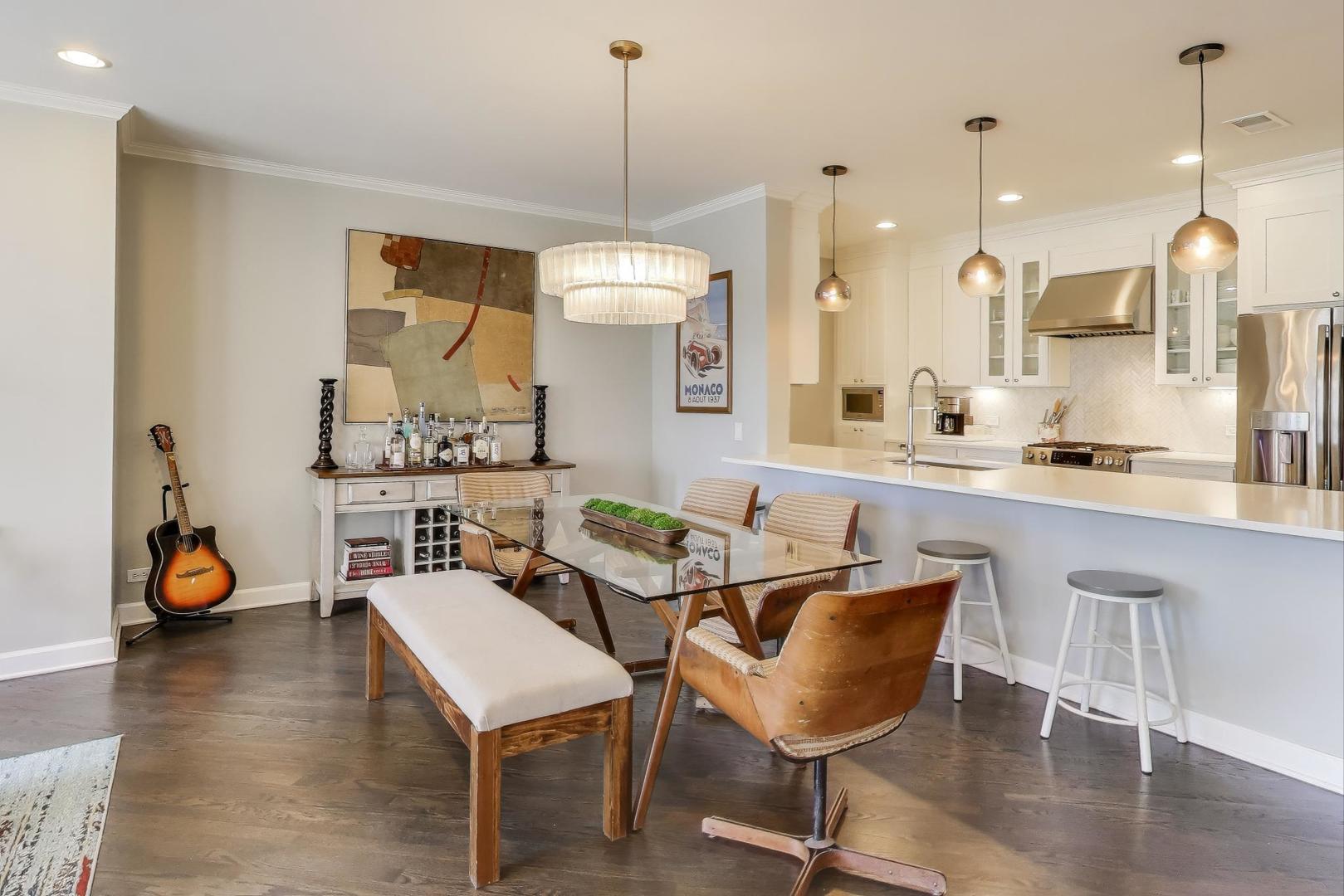 1414 North Wells Street, Unit 405 Chicago, IL 60610 - Photo 6 of 27 a dining room filled with furniture and wooden floor