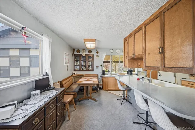 a room with furniture pool table and windows