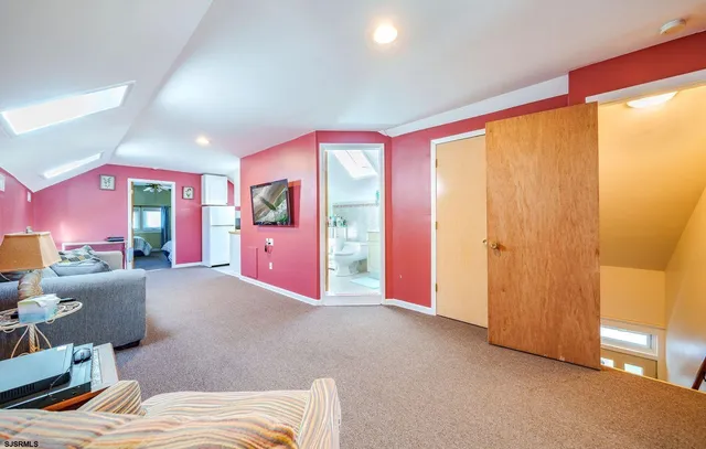 a bed room with a bed and a large window