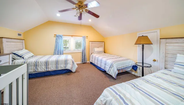 a bedroom with a bed and lamp