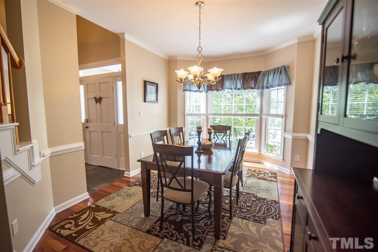 9720 Talman Court Raleigh, NC 27615 - Photo 8 of 30 Large bay window lets the light shine on the gorgeous Brazilian Koa exotic hardwood floors.