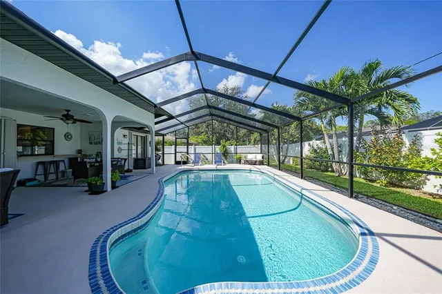 a view of a swimming pool with a patio