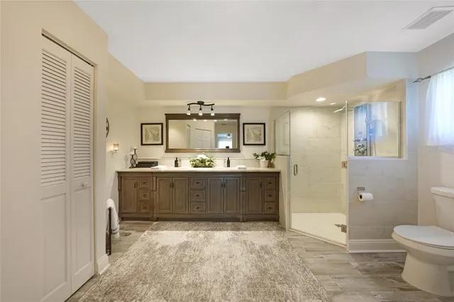 a room with a bed and a chandelier