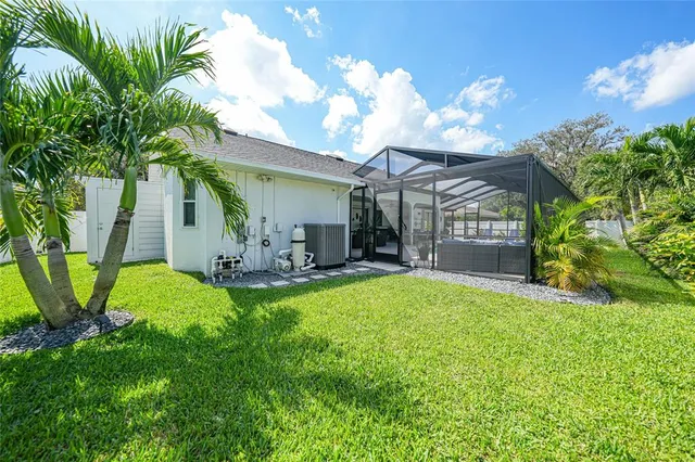 a view of a backyard with a garden and deck