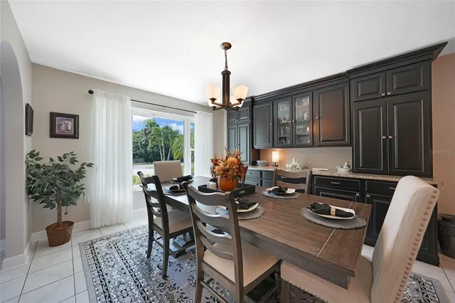 a dining room with furniture and window