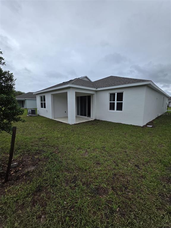 6008 Vision Road St. Cloud, FL 34771 - Photo 30 of 33 a house view with a garden space