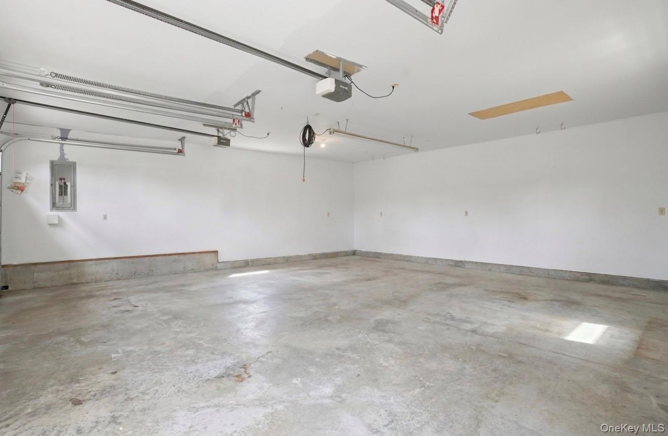 8 Division Road Wurtsboro, NY 12790 - Photo 47 of 50 2 car garage. Staged empty for your imagination. Fully insulated. Electric charging station.