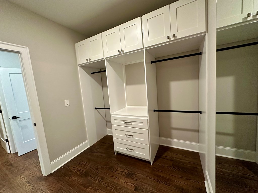 906 Winall Down Road Northeast Atlanta, GA 30319 - Photo 72 of 87 a view of walk in closet with empty racks