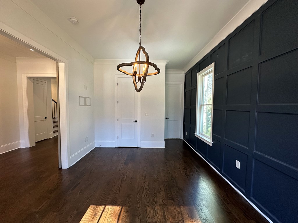 906 Winall Down Road Northeast Atlanta, GA 30319 - Photo 9 of 87 a view of a room with wooden floor window and a ceiling fan