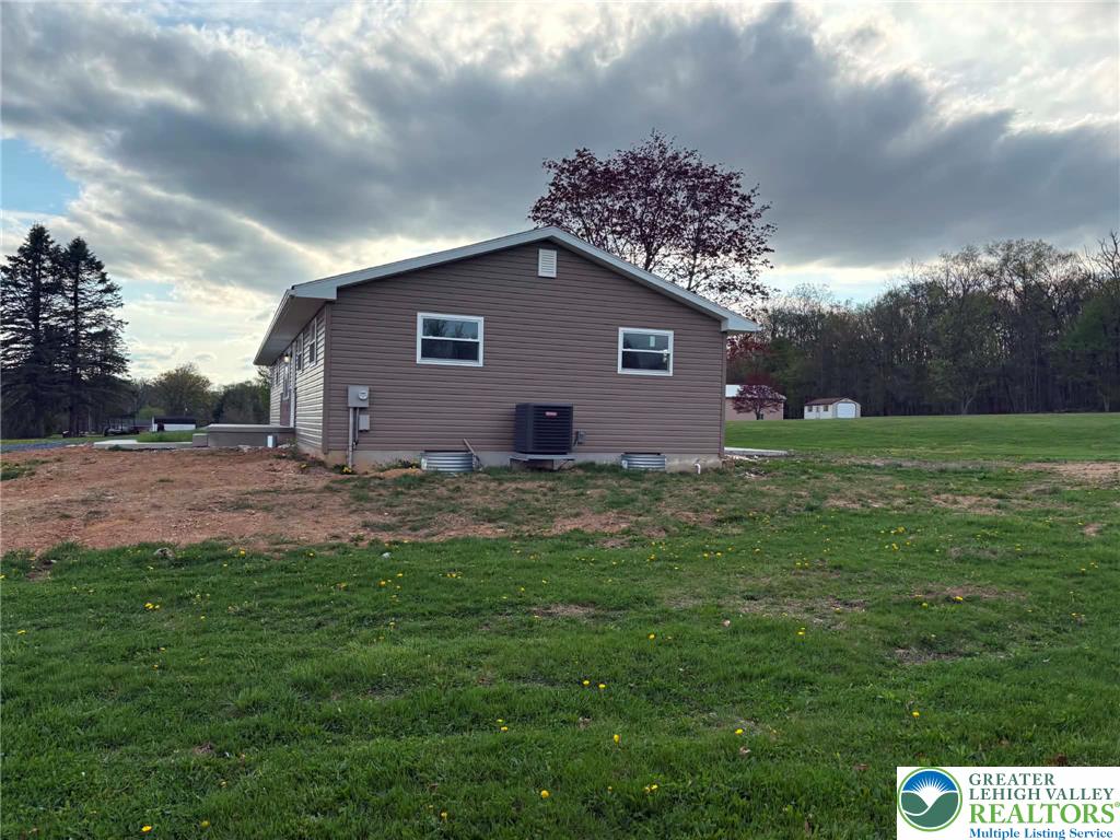 3957 Mountain Road Slatington, PA 18080 - Photo 4 of 33 a house view with a garden space