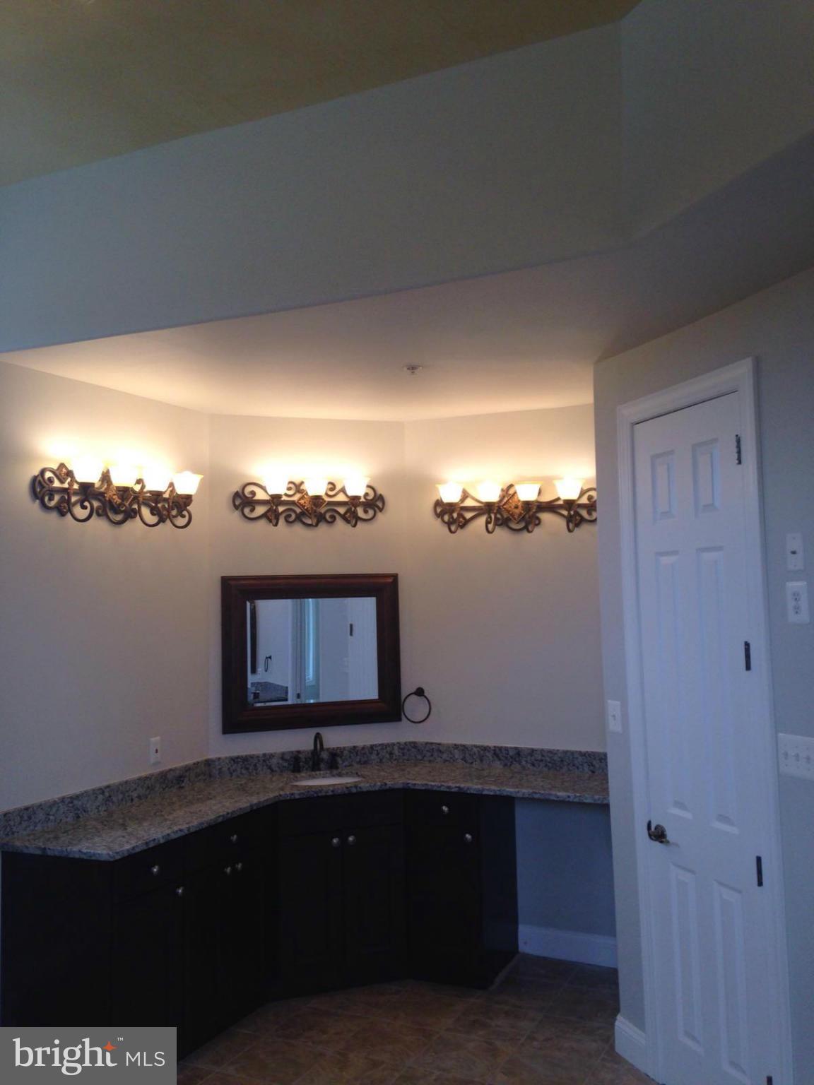 13901 Candy Hill Road Upper Marlboro, MD 20772 - Photo 13 of 20 a view of a living room and chandelier fan